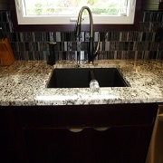 black sink with black back splash