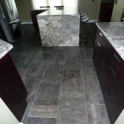 Dark cement looking tiled flooring