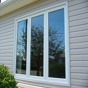 Large patio window on siding house